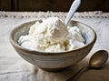 Bowl with tasty vanilla ice cream on table against light background. Created with Generative AI technology. Royalty Free Stock Photo