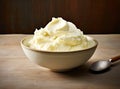 Bowl with tasty vanilla ice cream on table against light background. Created with Generative AI technology. Royalty Free Stock Photo