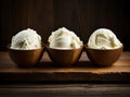 Bowl with tasty vanilla ice cream on table against light background. Created with Generative AI technology. Royalty Free Stock Photo
