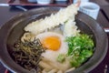 Bowl of Tempura Udon with raw egg