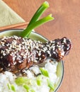 Bowl of teriyaki and sesame chicken on white rice Royalty Free Stock Photo