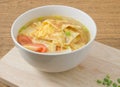 Bowl of Thai Omelet Soup with Tomatoes and Scallion