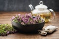 Bowl of thyme healing herbs, sachet bag full of thymus serpyllum medicinal herbs. Glass tea kettle of thyme healthy herbal tea. Royalty Free Stock Photo