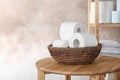 Bowl with toilet paper rolls on table indoors Royalty Free Stock Photo