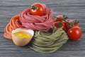 Bowl with tomato sauce, cherry tomatoes, italian pasta and egg on wooden background Royalty Free Stock Photo