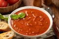 Bowl of tomato soup garnished with basil leaves Royalty Free Stock Photo