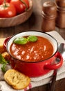 Bowl of tomato soup garnished with basil leaves Royalty Free Stock Photo