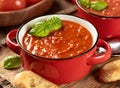 Bowl of tomato soup garnished with basil leaves Royalty Free Stock Photo