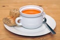 Bowl of tomatoe soup with brown bread