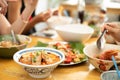 A Bowl of Tomyum Spicy noodle soup with blur background