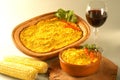 Bowl of traditional Chilean Pastel de Choclo photographed with natural light. Below the corn-basil mix is ground meat Royalty Free Stock Photo