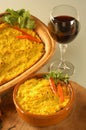 Bowl of traditional Chilean Pastel de Choclo photographed with natural light. Below the corn-basil mix is ground meat Royalty Free Stock Photo