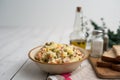 Bowl of traditional Russian salad called Olivie, Russian New Year or Christmas salad on wooden background. Royalty Free Stock Photo