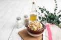 Bowl of traditional Russian salad called Olivie, Russian New Year or Christmas salad on wooden background. Royalty Free Stock Photo