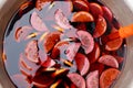 Bowl of traditional sangria or punch made of red wine with lemon slices