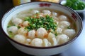 A bowl of tsumire jiru with fish ball soup Royalty Free Stock Photo