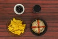 Bowl of tuna salad, tortilla chips, olives and glass of red wine Royalty Free Stock Photo