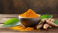 Bowl with turmeric powder on wooden table. Raw curcumin roots