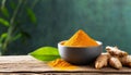 Bowl with turmeric powder on wooden table. Raw curcumin roots