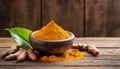 Bowl with turmeric powder on wooden table. Raw curcumin roots