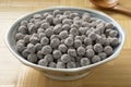 Bowl with uncooked black tapioca pearls close Royalty Free Stock Photo