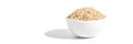 A bowl of uncooked brown rice, isolated against a white background. Healthy Royalty Free Stock Photo