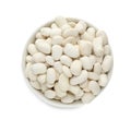 Bowl of uncooked navy beans isolated on white, top view Royalty Free Stock Photo