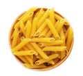 Bowl with uncooked penne pasta on white background Royalty Free Stock Photo