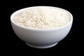 Bowl of uncooked white long grain rice on black. Royalty Free Stock Photo