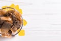 Bowl with used tea bags on white wooden table, top view. Space for text Royalty Free Stock Photo