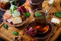 Bowl with various pieces of turkish delight lokum and black tea Royalty Free Stock Photo