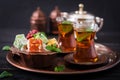 Bowl with various pieces of turkish delight lokum and black tea Royalty Free Stock Photo