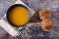 Bowl of vegetable soup with brown bread rolls Royalty Free Stock Photo