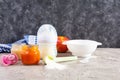 Bowl with vegetables puree and bottle of baby food on gray background Royalty Free Stock Photo