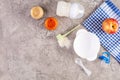 Bowl with vegetables puree and bottle of baby food on gray background. Top view Royalty Free Stock Photo