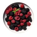 Bowl Velvety Purple Base, Blackberries, Raspberries, Almond Slivers On White Plate On A White Background