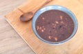 A bowl of warm Laba porridge and a wooden spoon