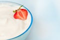 Bowl with whip cream and strawberry
