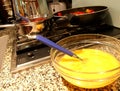 Bowl with whipped egg in a kitchen while preparing spaghetti all