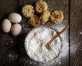 Bowl of white flour, eggs and pasta on white wooden table, top v Royalty Free Stock Photo