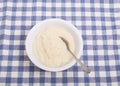 Bowl of White Grits on Blue Check Tablecloth Royalty Free Stock Photo