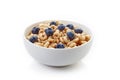 Bowl of whole grain cheerios cereal with blueberries isolated on Royalty Free Stock Photo