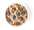 Bowl of whole grain cheerios cereal with blueberries isolated on