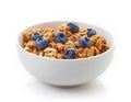 Bowl of whole grain muesli and blueberries isolated on white Royalty Free Stock Photo