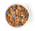 Bowl of whole grain muesli and blueberries isolated on white