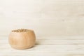 Bowl with wholegrain spelt farro on wooden table