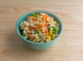 Bowl of wild and brown rice with veggies on table Royalty Free Stock Photo