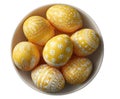 Bowl of yellow Easter eggs with white decorative patterns on white background Keywords: easter Royalty Free Stock Photo