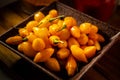 Yellow peppers with detail of saffron and paprika glasses.