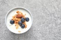 Bowl with yogurt, berries and granola on table Royalty Free Stock Photo